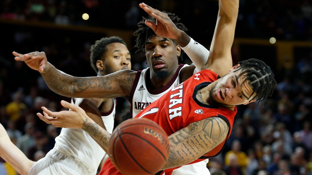Utah forward Timmy Allen (1) has the ball knocked away by Arizona State's Romello White, center, during the first half of an NCAA college basketball game Saturday, Jan. 18, 2020, in Tempe, Ariz. (AP Photo/Ralph Freso)