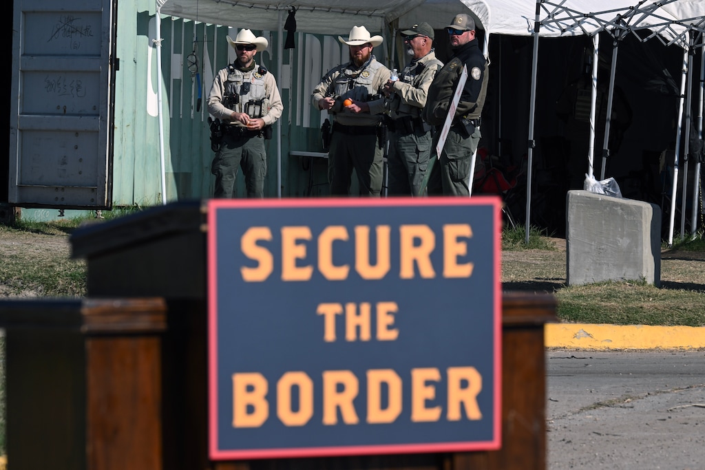 (Kenny Holston | The New York Times) Law enforcement officers with the Florida Fish and Wildlife Conservation Commission await the start of a news conference called by House Republicans near the border in Eagle Pass, Texas, on Wednesday, Jan. 3, 2023. During the trip to the southern border, Utah Rep. Burgess Owens attacked the Biden administration's handling of the southern border.