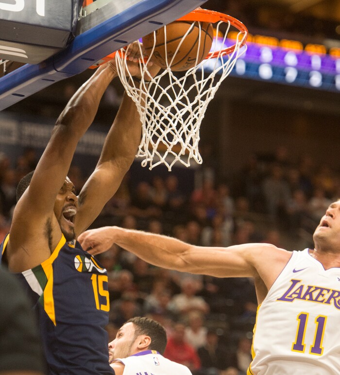 (Rick Egan  |  The Salt Lake Tribune)  Utah Jazz forward Derrick Favors (15) dunks the ball, as Los Angeles Lakers center Brook Lopez (11) defends, in NBA action in Salt Lake City, Saturday, October 28, 2017.


