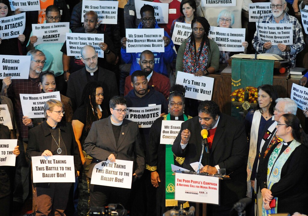 The Rev. William J. Barber  speaks at a rally in opposition to Republican U.S. Senate candidate Roy Moore at a church in Birmingham, Ala., on Saturday, Nov. 18, 2017.  Barber and other speakers criticized Moore over allegations he made improper sexual advances toward teenage girls decades ago.  (AP Photo/Jay Reeves)