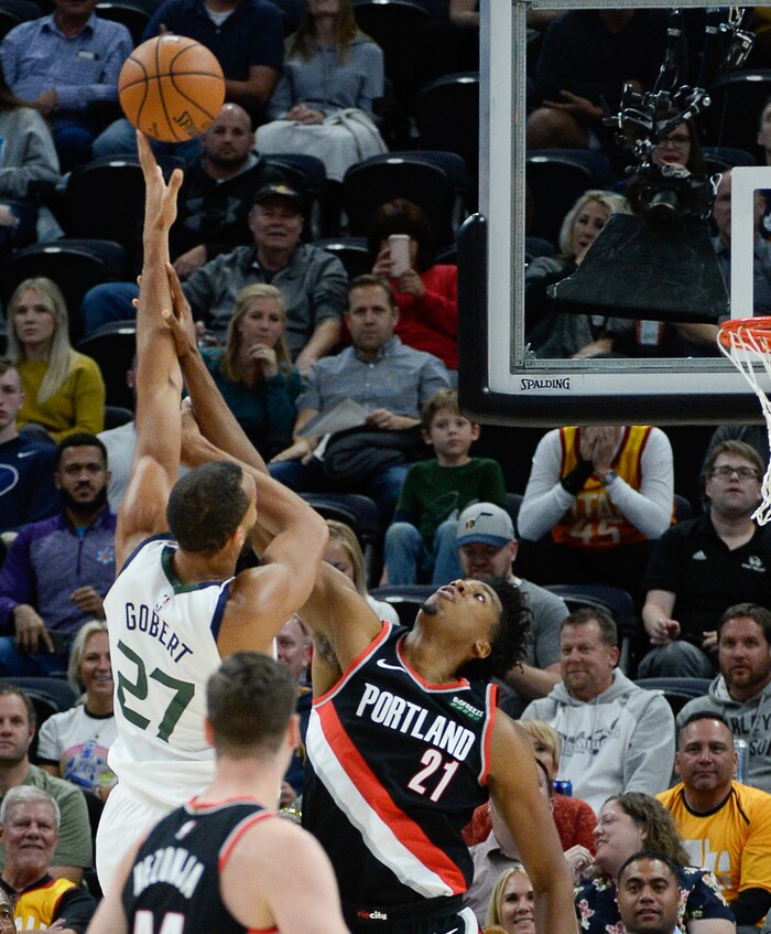 (Francisco Kjolseth  |  The Salt Lake Tribune)  Utah Jazz center Rudy Gobert (27) goes up against Portland Trail Blazers center Hassan Whiteside (21) as the Utah Jazz host the Portland Trailblazers in their NBA basketball game at Vivint Smart Home Arena in Salt Lake City on Wed. Oct. 16, 2019.