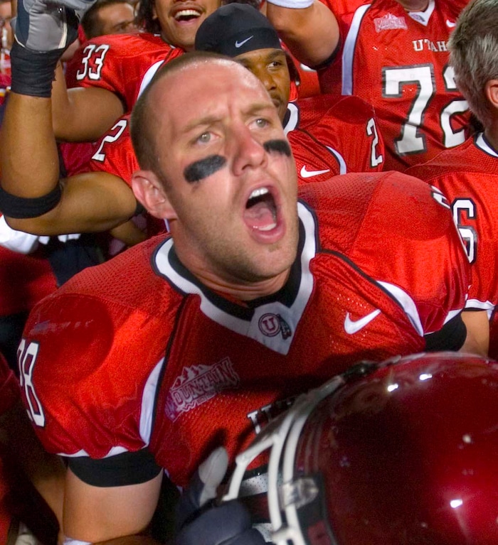 (Trent Nelson  |  Tribune File Photo)  Utah's Steve Tate sings the school song, "Utah Man" in a traditional postgame celebration after beating Arizona Friday September 2, 2005 at Rice-Eccles Stadium.