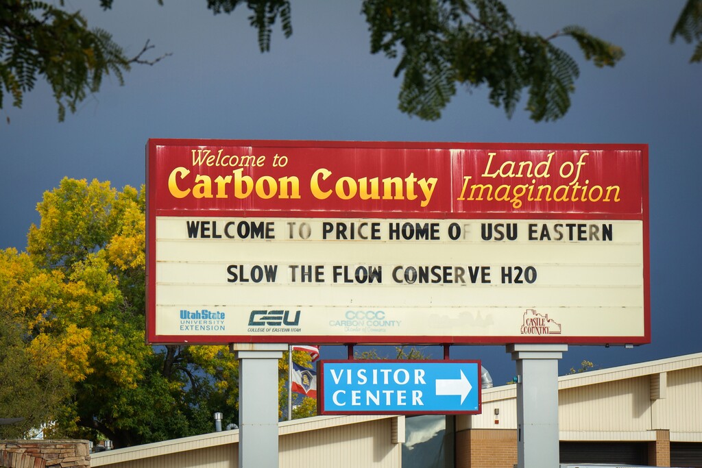 (David Condos | KUER) A welcome sign in Price reminds residents to save water, Sept. 30, 2025. Consistent messaging is likely one of the reasons Carbon County has become a leading county for conservation in Utah.