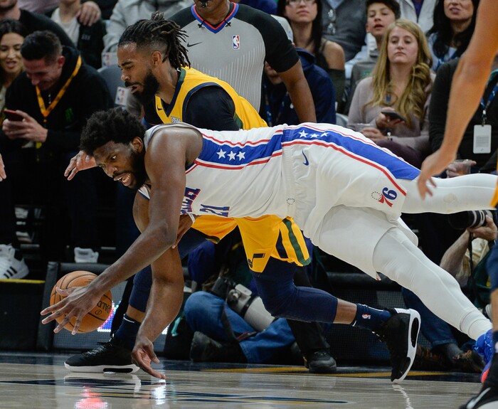 (Francisco Kjolseth  |  The Salt Lake Tribune)  Philadelphia 76ers center Joel Embiid (21) battles Utah Jazz guard Mike Conley (10) for a ball as the Utah Jazz host the Philadelphia 76ers in their NBA basketball game at Vivint Smart Home Arena in Salt Lake City on Wednesday, Nov. 6, 2019.