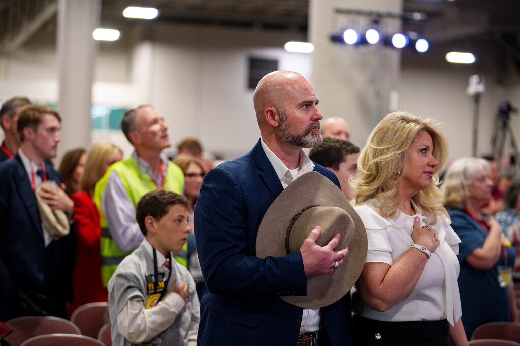(Trent Nelson  |  The Salt Lake Tribune) Delegates stand for the national anthem at the Utah Republican Nominating Convention in Salt Lake City in April 2024.