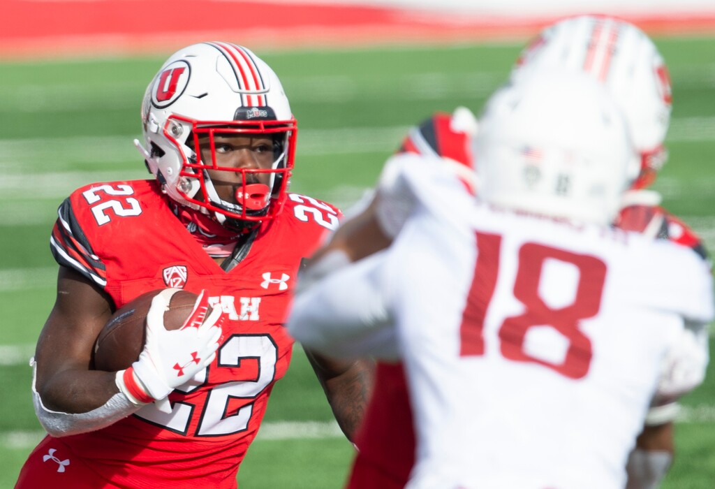 (Rick Egan | The Salt Lake Tribune) Utah  running back Ty Jordan (22) runs the ball for the Utes, in PAC-12 football acton between Utah Utes and Washington State Cougars at Rice-Eccles Stadium on Saturday, Dec. 19, 2020.