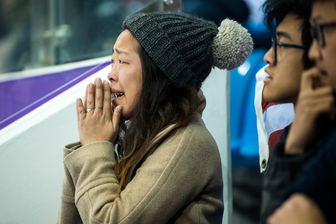 (Chris Detrick  |  The Salt Lake Tribune)  Nathan Chen's sister Alice Chen, left, reacts as his score is announced in the Men Single Skating Free Skating at Gangneung Ice Arena during the Pyeongchang 2018 Winter Olympics Saturday, Feb. 17, 2018. Chen landed a record six quadruple jumps, scoring 215.08. At right is his brother Colin Chen and cousin Kevin Wang.