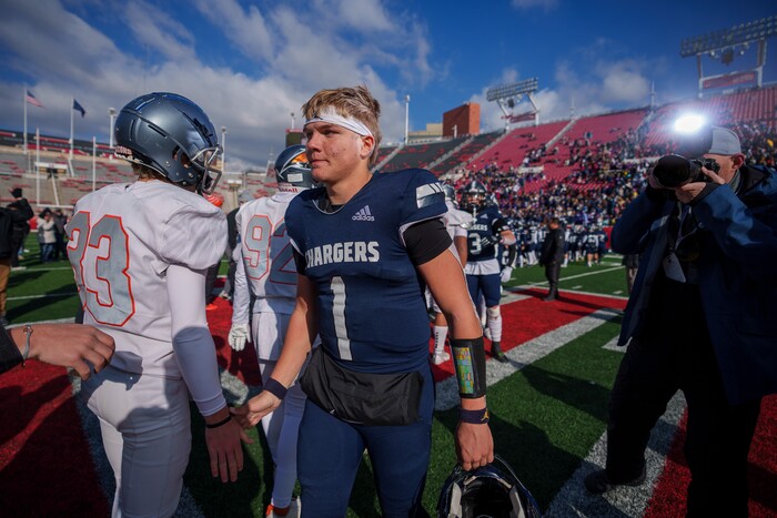 (Trent Nelson  |  The Salt Lake Tribune) Corner Canyon's Isaac Wilson (1) shakes hands with Skyridge players after losing in the 6A high school football championship game at Rice-Eccles Stadium in Salt Lake City on Friday, Nov. 18, 2022.