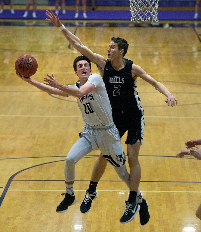 Scott Sommerdorf | The Salt Lake TribuneCopper Hills' Isaac Flores tries to block Riverton's Ryen Edwards' first half shot. Copper Hills defeated Riverton 54-50, Friday, February, 2, 2018. 