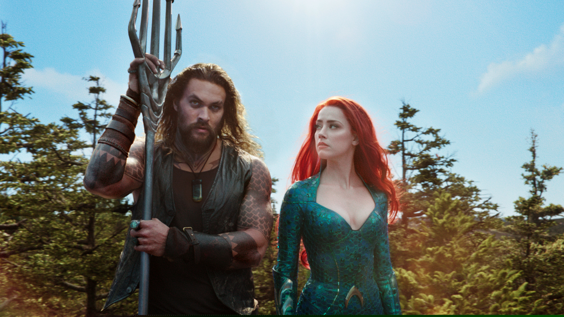 Jason Momoa and Amber Heard in a scene from "Aquaman." (Warner Bros. Pictures via AP)