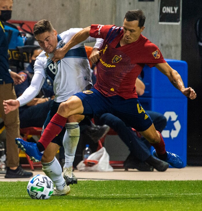 (Rick Egan  |  The Salt Lake Tribune)   Real Salt Lake defender Donny Toia (4) brings the ball down field as Vancouver Whitecaps defender Jake Nerwinski (28) defends, in MLS soccer action between Real Salt Lake and the Vancouver Whitecaps at Rio Tinto Stadium on Saturday, Sept. 19, 2020.

 