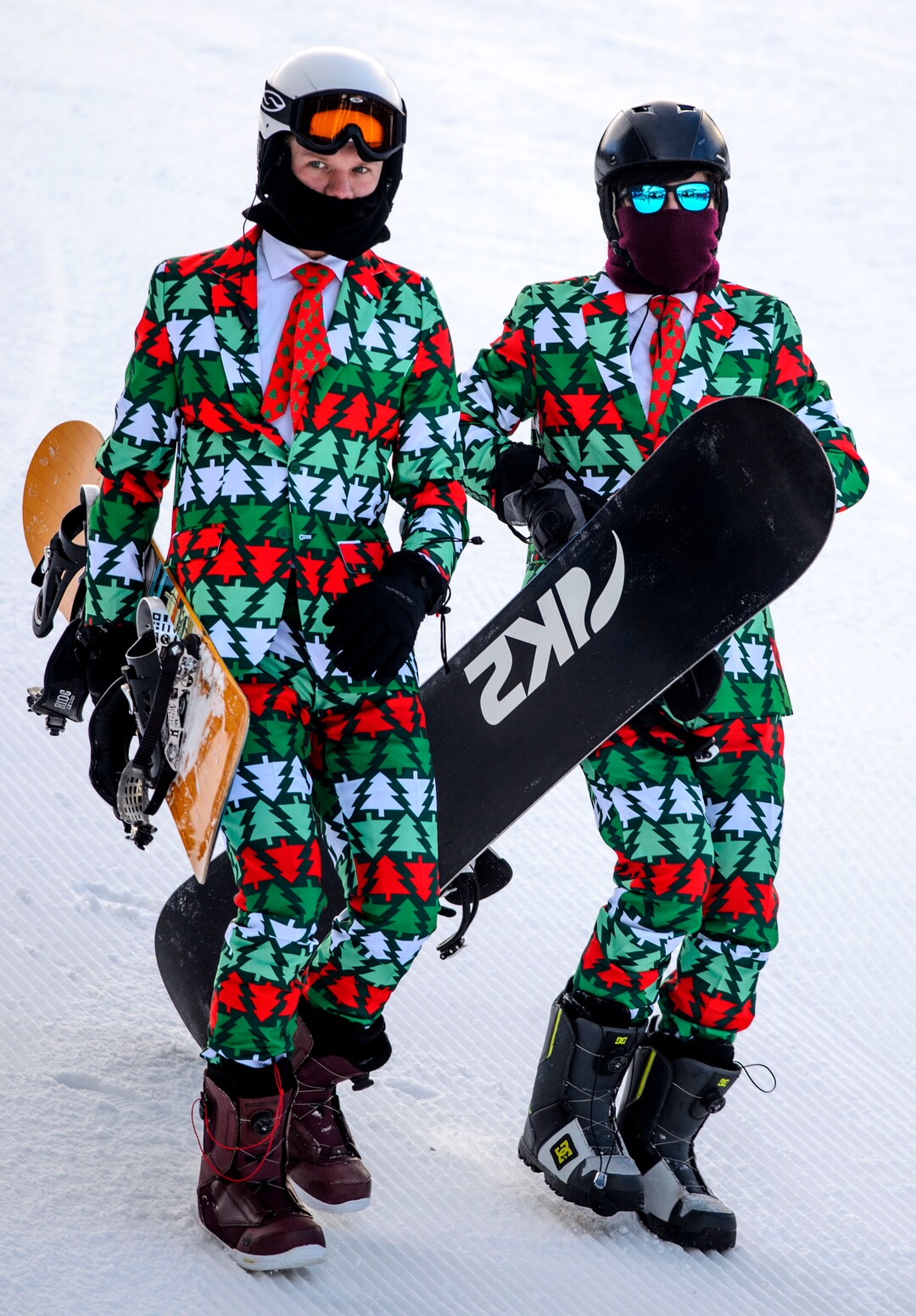 (Steve Griffin  |  The Salt Lake Tribune) Dressed in holiday suits and ties snowboarders Braden Huffman and Seth Walker head to the lift at Brighton ski area in Salt Lake City Monday January 1, 2018. Huffman, who is from Arizona and attending school in Provo Utah, says "the conditions could be worse but could be better, but I'm not complaining" 