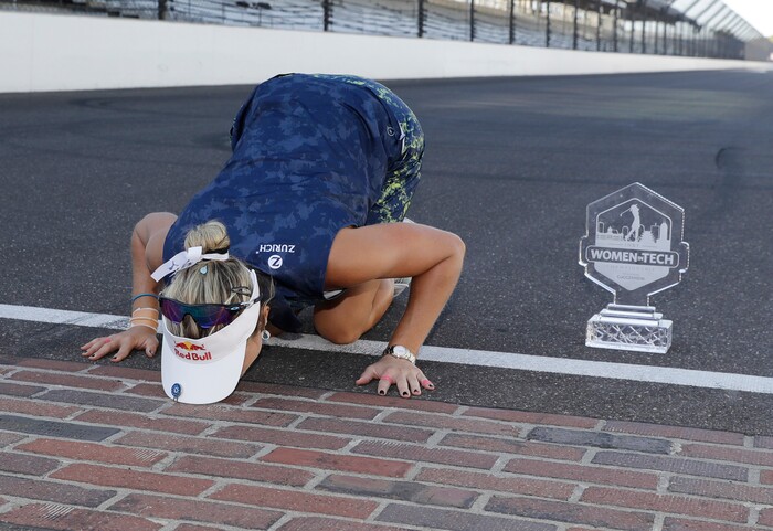 Lexi Thompson kisses the Yard of Bricks after winning the Indy Women in Tech Championship golf tournament, Saturday, Sept. 9, 2017, in Indianapolis. (AP Photo/Darron Cummings)