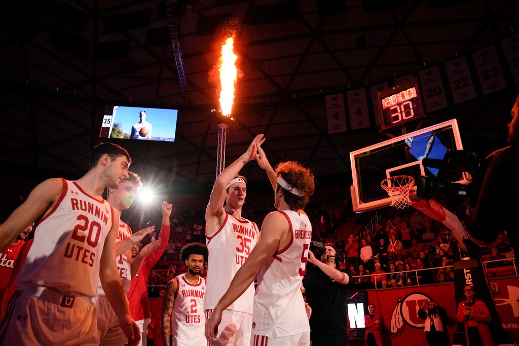 Utah center Branden Carlson (35) and Utah guard Jaxon Brenchley (5) high-five before playing Southern California in an NCAA college basketball game Saturday, Feb. 25, 2023, in Salt Lake City. (AP Photo/Ben B. Braun)