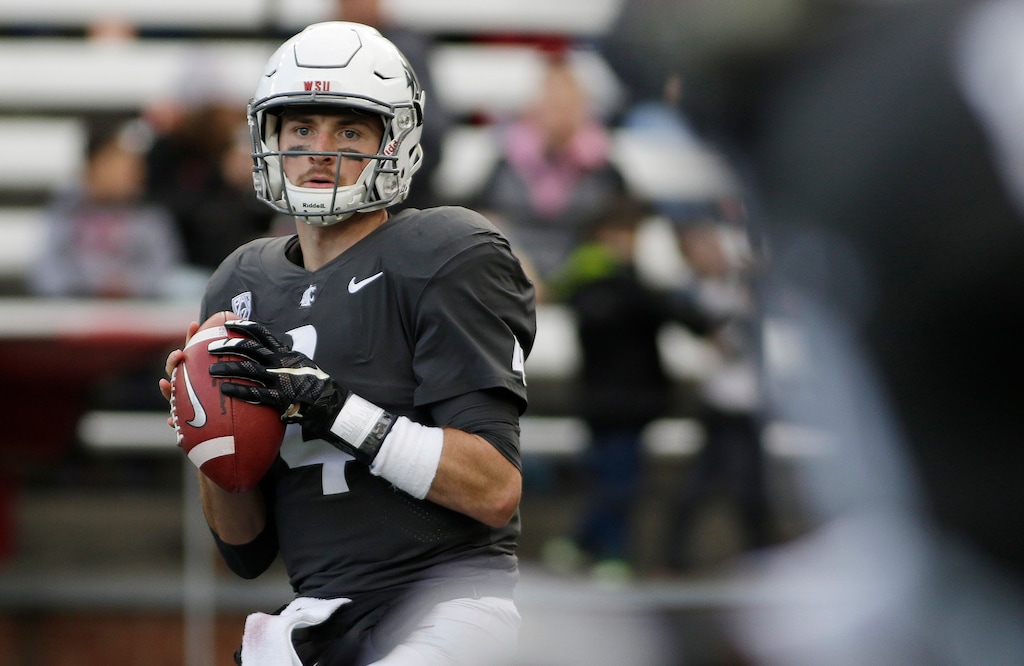 FILE - In this Sept. 23, 2017, file photo, Washington State quarterback Luke Falk (4) looks for a receiver during the second half of an NCAA college football game against Nevada in Pullman, Wash. Falk didn’t draw a lot of recruiting interest out of high school in Logan, Utah. But the former walk-on at No. 8 Washington State has blossomed into a Heisman Trophy candidate as the undefeated Cougars raise eyebrows across the college football world.  (AP Photo/Young Kwak, File)