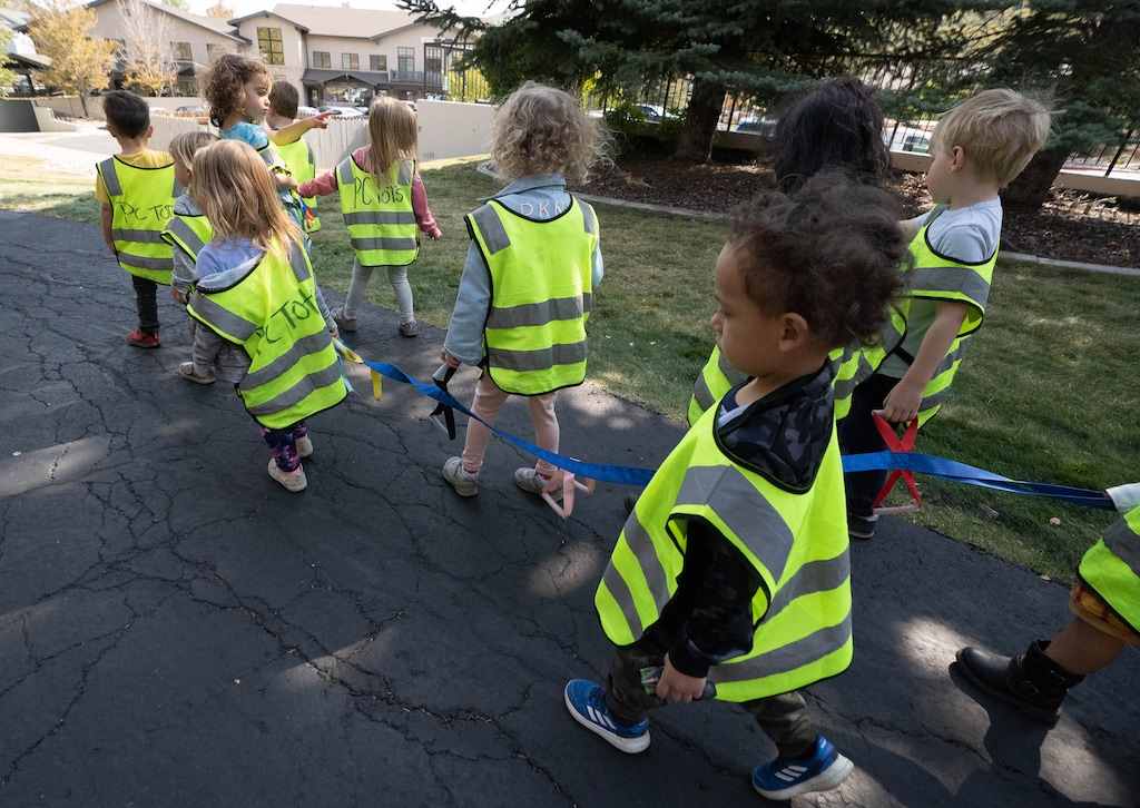 (Francisco Kjolseth | The Salt Lake Tribune) Holding on to a tether to stay safe, 3-year-olds from PC Tots return from an outing before nap time in Park City on Thursday, Sept. 23, 2021. The Utah Office of Child Care has received $574 million in federal COVID-19 relief funding to help stabilize the child care industry in the state during the coronavirus pandemic.