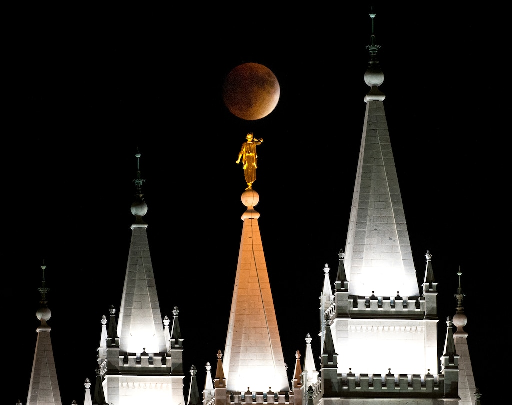 (Lennie Mahler | The Salt Lake Tribune)
The supermoon rises as it simultaneously is eclipsed over the LDS Temple in Salt Lake City, Utah. Sunday, Sept. 27, 2015.