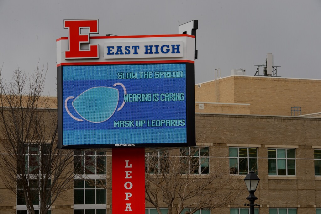 (Trent Nelson  |  The Salt Lake Tribune) A sign at Salt Lake City's East High School addresses COVID-19 on Thursday, Feb. 11, 2021.