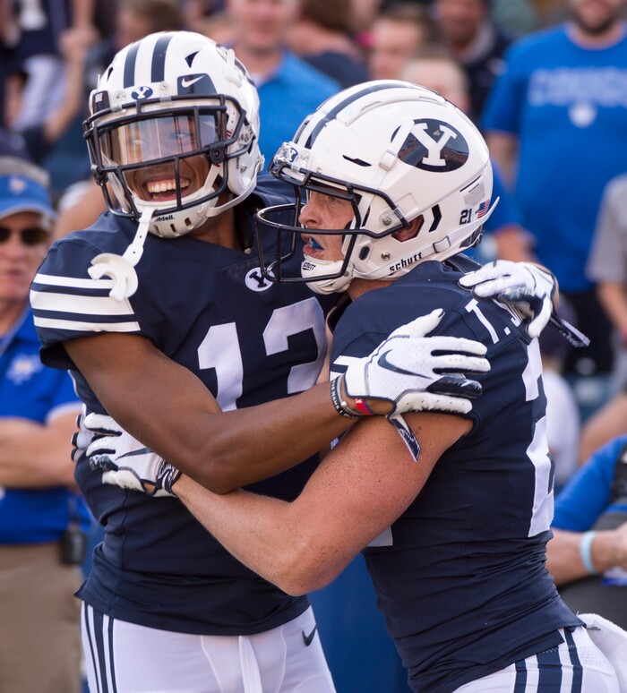 (Rick Egan  |  The Salt Lake Tribune)    Brigham Young Cougars wide receiver Micah Simon (13) congratulates Brigham Young Cougars wide receiver Talon Shumway (21) after Shumway grabbed touchdown pass, in football action Brigham Young Cougars vs McNeese State Cowboys at Lavell Edwards Stadium, Saturday, Sept. 22, 2018.


