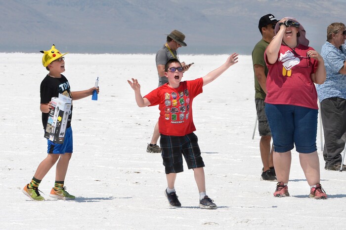 (Scott Sommerdorf   |  The Salt Lake Tribune)   Travis and Kelly Tabbal's sons dance and celebrate the successful launch of their rocket during "HellFire" — the event sponsored by the Utah Rocket Club on Saturday, Aug. 5, 2017.