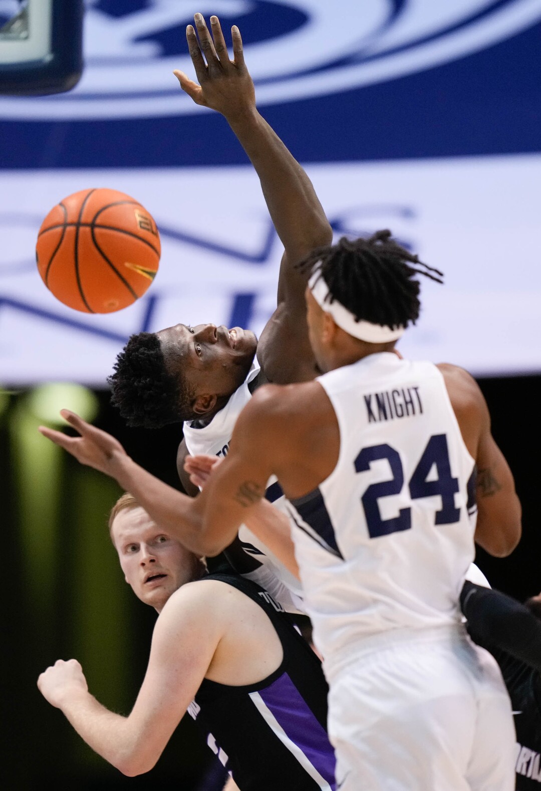 (Francisco Kjolseth | The Salt Lake Tribune) in WCC basketball action between the Brigham Young Brigham Young Cougars forward Gideon George (5) reaches back trying to get the ball above Portland Pilots guard Chris Austin (5) Cougars and the Portland Pilots, at the Marriott Center, on Saturday, January 22, 2022.