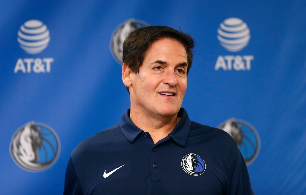 FILE - In this Monday, Feb. 26, 2018, file photo, Dallas Mavericks owner Mark Cuban stands on stage before a news conference in Dallas. Cuban is denying a 2011 allegation of sexual assault after a weekly alternative newspaper in Oregon published details of a case that prosecutors didn't pursue, saying they didn't believe there was evidence to support the claim. (AP Photo/Ron Jenkins, File)