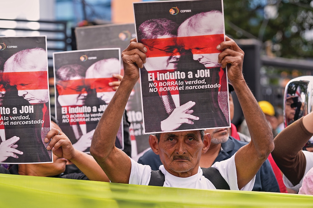 Farmers protest against President Donald Trump's pardon of Honduras' former President Juan Orlando Hernandez in Tegucigalpa, Honduras, on Dec. 4, 2025. (AP Photo/Moises Castillo)