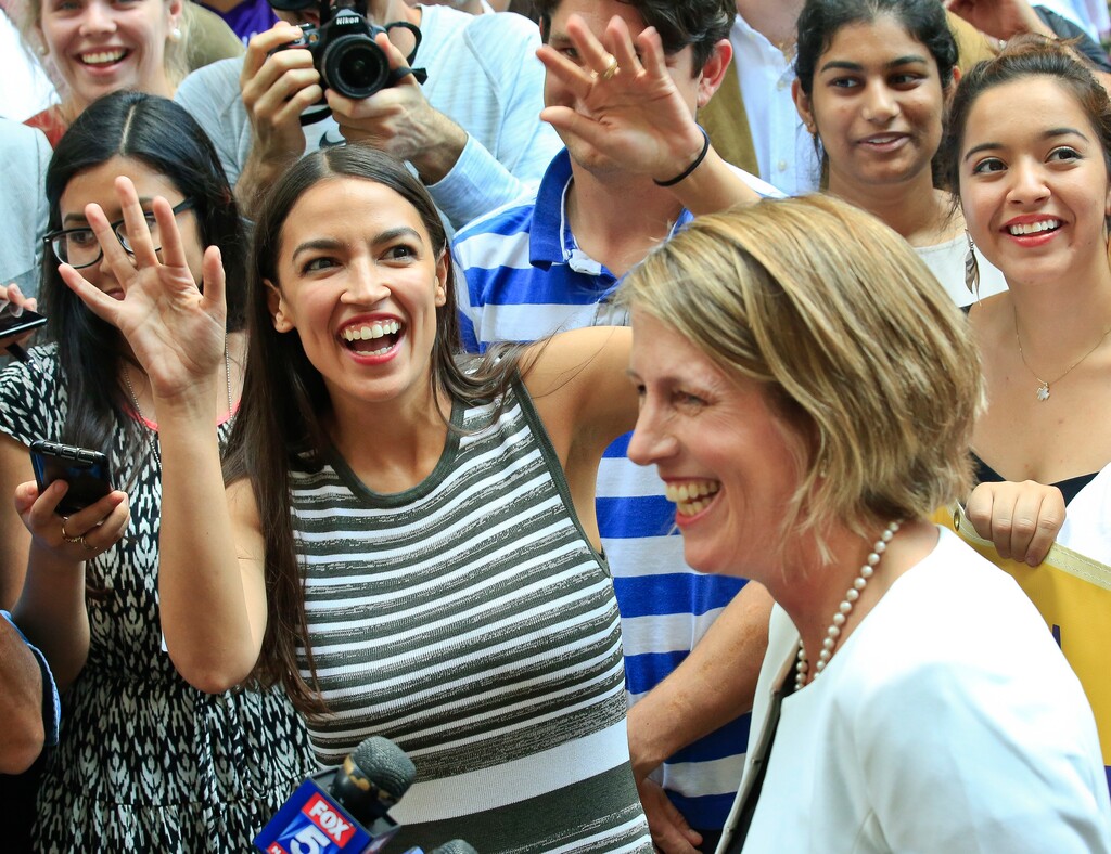 Alexandria Ocasio-Cortez, left, the surprise winner in the congressional race who unseated 20-year incumbent Joe Crowley in New York's Congressional District 14, stands next to Zephyr Teachout, after endorsing her candidacy for Attorney General during a press conference, Thursday, July 12, 2018, in New York. (AP Photo/Bebeto Matthews)
