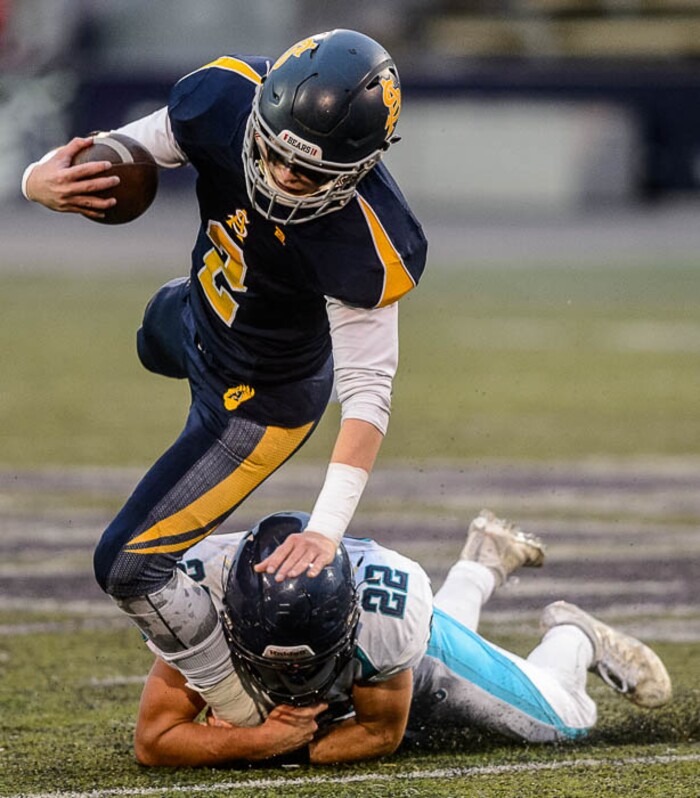 (Trent Nelson | The Salt Lake Tribune)  Summit Academy quarterback Haden Reynolds is brought down by Juan Diego's Tristen Tonozzi. Summit Academy faces Juan Diego High School in a class 3A state semifinal football game at Weber State University's Stewart Stadium, Saturday November 4, 2017.