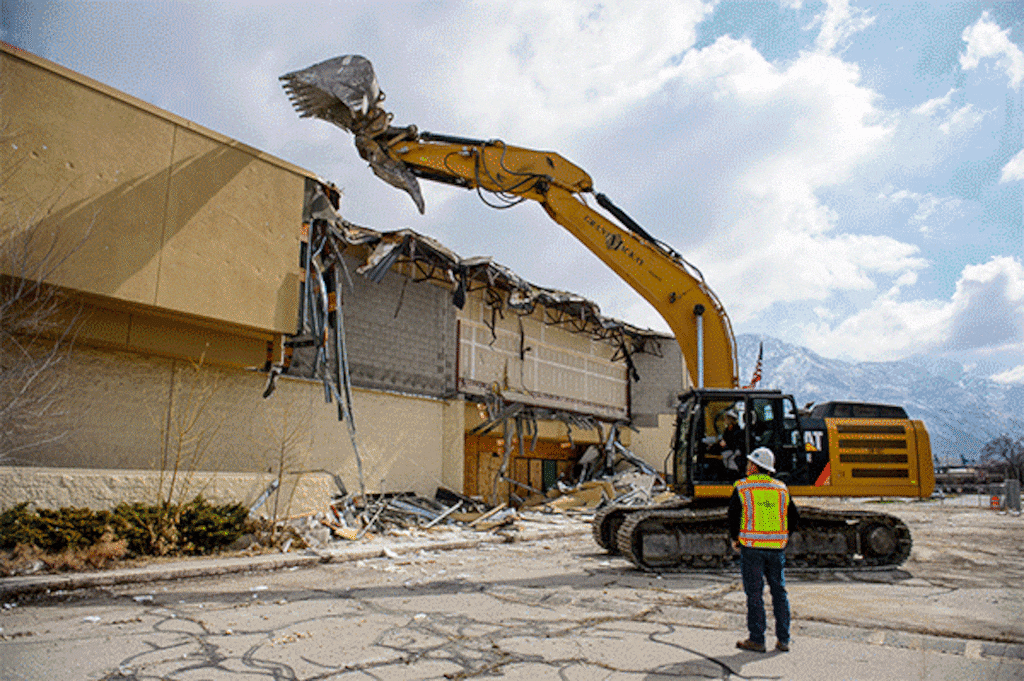 (Trent Nelson  |  The Salt Lake Tribune) Provo employee Kaye Neves pulls down the face of what was a Shopko as the now-defunct Plum Tree shopping center in Provo is demolished to make way for a new development on Tuesday, March 23, 2021.