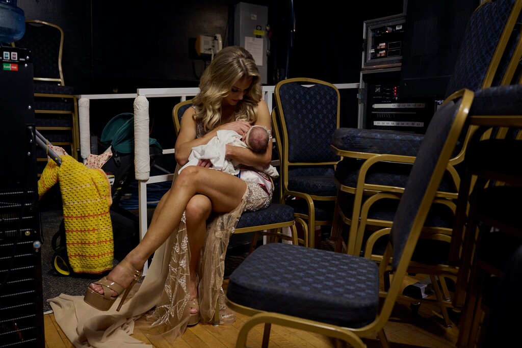 (Bridget Bennett | The New York Times) Hannah Neeleman, last year’s Mrs. American pageant winner, nurses her newborn daughter, Flora Jo, after the Mrs. World beauty pageant at the Westgate Hotel and Casino in Las Vegas, Jan. 21, 2024. Neeleman, a Utah homemaker with a huge TikTok following, went to Las Vegas, newborn in tow, to compete for Mrs. World.
