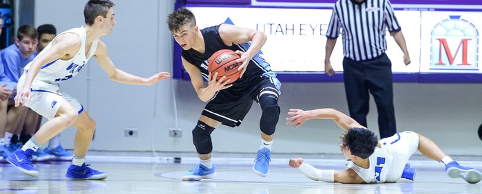 (Leah Hogsten  |  The Salt Lake Tribune) West Jordan's Christian Rhodes-Jimenez (15) steals from Pleasant Grove's Kawika Akina (21). Pleasant Grove defeated West Jordan 62-54 in the 6A High School Boys' Basketball Tournament opening game at Weber State University’s Dee Events Center in Ogden,  Tuesday, Feb. 27, 2018. 