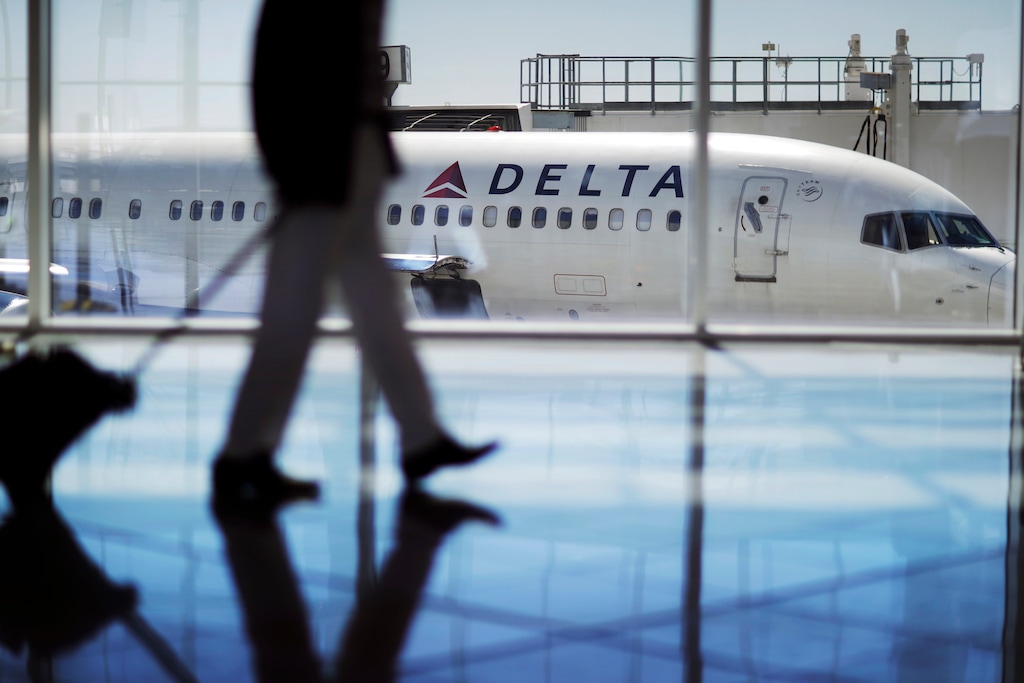 FILE - In this Oct. 13, 2016, file photo, a Delta Air Lines jet sits at a gate at Hartsfield-Jackson Atlanta International Airport in Atlanta. Georgia lawmakers punished Atlanta-based Delta Air Lines on Thursday, March 1, 2018, for its decision to cut business ties with the National Rifle Association in the wake of a shooting at a Florida high school that killed over a dozen people. A tax measure, which was stripped of a jet-fuel tax break, passed the GOP-dominated Senate 44-10. (AP Photo/David Goldman, File)