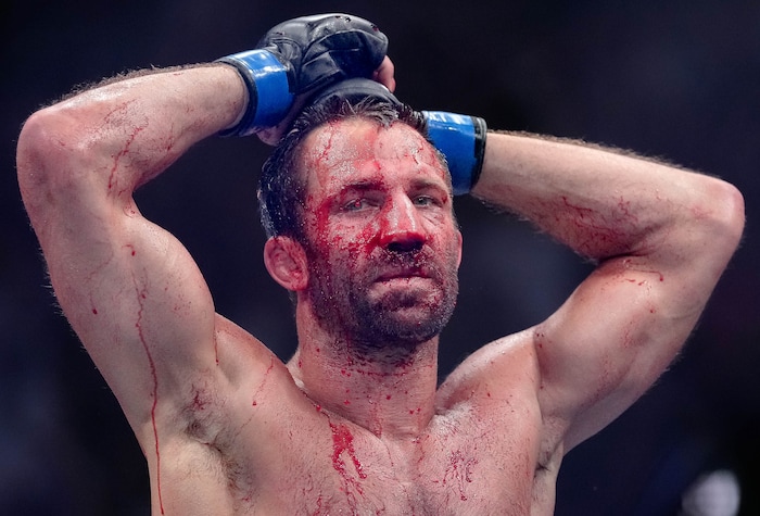 (Francisco Kjolseth | The Salt Lake Tribune)  Former middleweight champion Luke Rockhold of the United States concludes his bloody round with No. 6 ranked middleweight Paulo Costa of Brazil, during their UFC 278 mixed martial arts bout in the octagon at Vivint Arena in Salt Lake City on Saturday, Aug. 20, 2022. 
