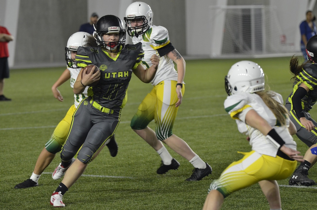 (Alex Vejar | The Salt Lake Tribune)  Murray High’s Olivia Green makes her way through the defense during a practice of the Utah Girls’ Tackle Football League on Wednesday, Jan. 22, 2020, at the Zions Bank Training Center in Herriman.