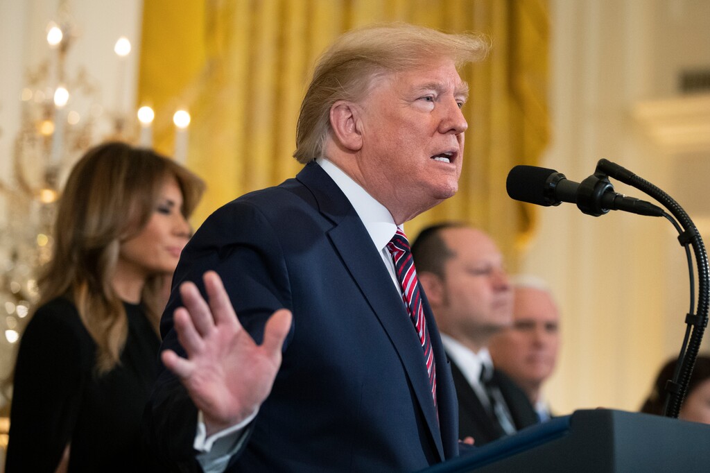 President Donald Trump, with first lady Melania Trump, speaks during a Hanukkah reception in the East Room of the White House Wednesday, Dec. 11, 2019, in Washington. (AP Photo/Manuel Balce Ceneta)