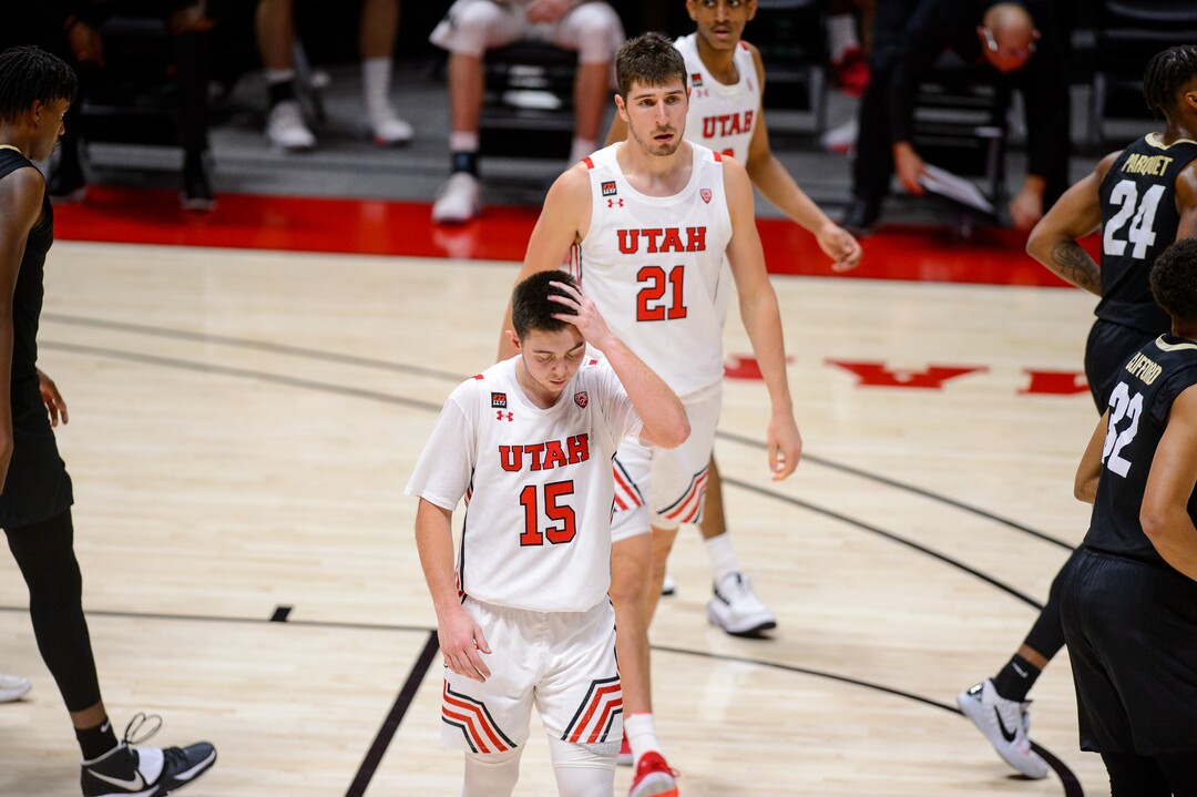 (Trent Nelson  |  The Salt Lake Tribune) Utah Utes guard Rylan Jones (15) and Utah Utes forward Riley Battin (21) walk off the court after the loss as Utah hosts Colorado, NCAA basketball in Salt Lake City on Monday, Jan. 11, 2021.