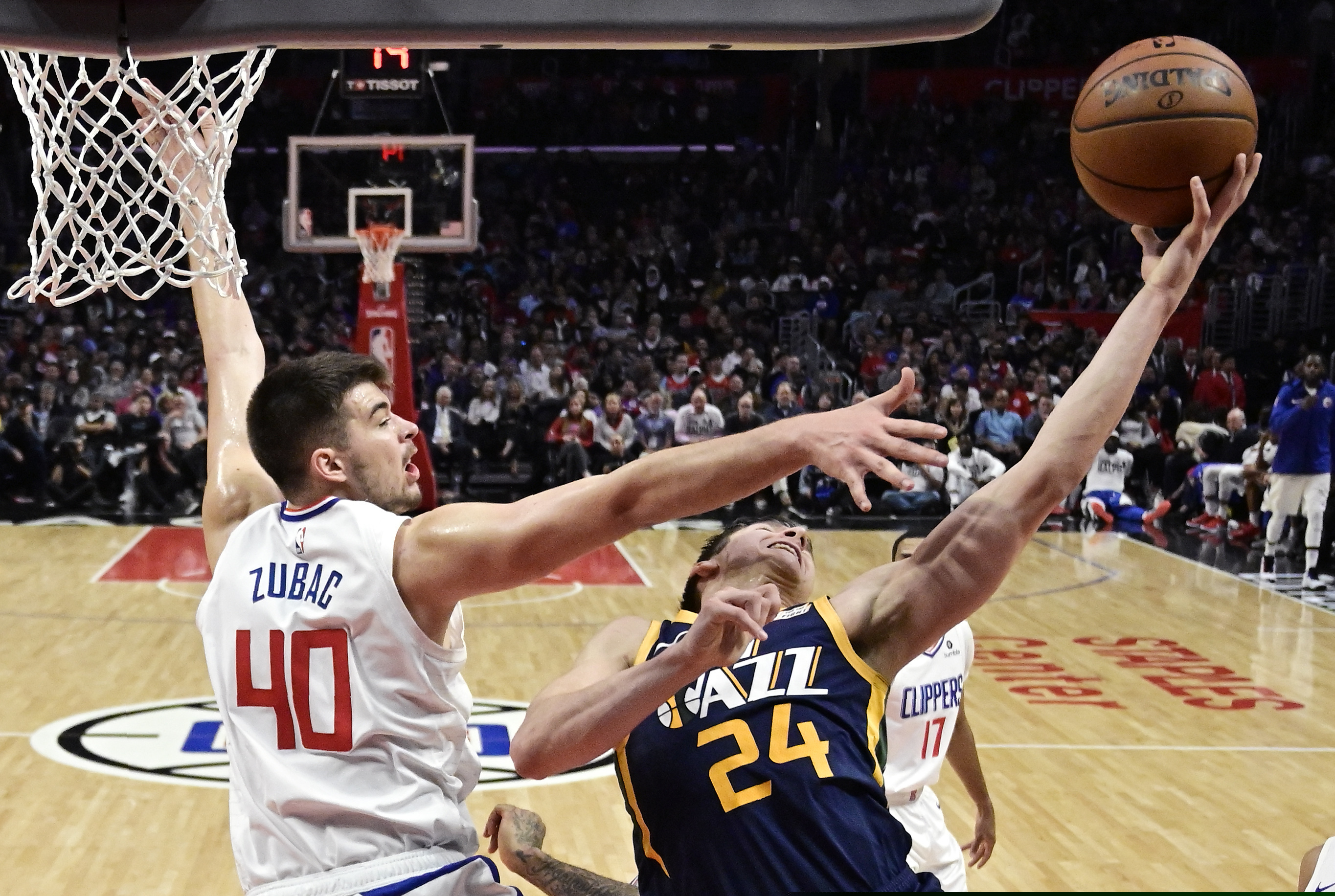 Utah Jazz guard Grayson Allen, right, shoots as Los Angeles Clippers center Ivica Zubac defends during the second half of an NBA basketball game Wednesday, April 10, 2019, in Los Angeles. The Clippers won 143-137. (AP Photo/Mark J. Terrill)