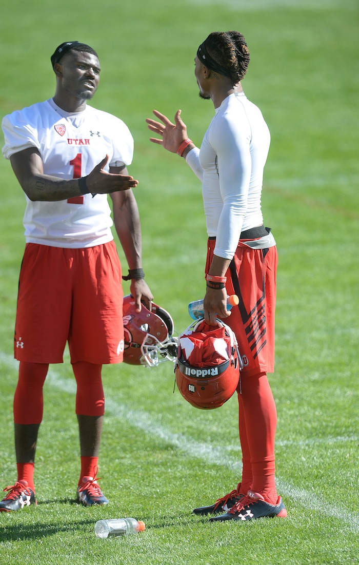 Scott Sommerdorf | The Salt Lake Tribune
Utah QB Tyler Huntley, left, meets with new Utah WR Darren Carrington II after the first day of Utah fall football camp, Friday, July 28, 2017. during the first day of Utah fall football camp, Friday, July 28, 2017.