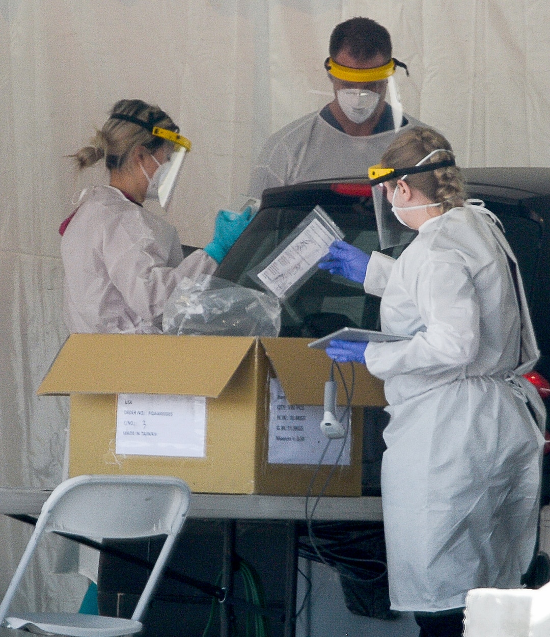 (Francisco Kjolseth | The Salt Lake Tribune) Testing for COVID-19 is performed at the Wasatch County Event Center in Heber City on Wednesday, April 22, 2020, under one of the TestUtah.com contracts the state has with Nomi Health.