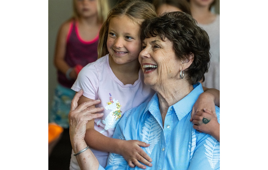 (Rick Egan | The Salt Lake Tribune) Louise Bitner get hugs from her student, Emma Croft, on her last day as a teacher at Dilworth Elementary School, on Friday, June 3, 2022. Bitner is retiring after 51 years as a kindergarten and first grade teacher.