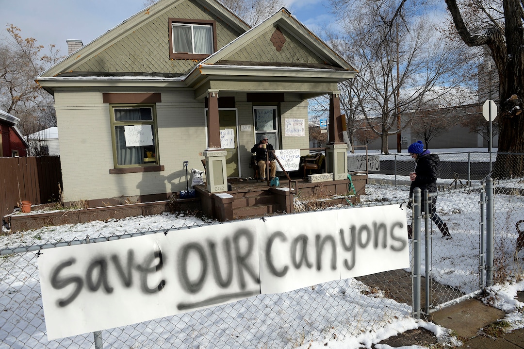 (Al Hartmann  |  The Salt Lake Tribune) 	House near LDS Welfare Square at 800 S. 800 W. prepares for President Trump's motorcade with protest signs Monday Dec. 4.  Trump is to visit Welfare Square with leaders of LDS Church before heading to the Utah Capitol where he is expected to shrink Bear's Ears and Grandstaircase National Monuments. 