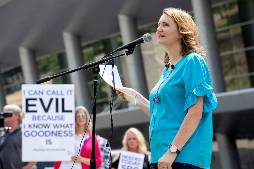 (AP Photo/Jeffrey McWhorter) In this Tuesday, June 12, 2018, photo, rape survivor and abuse victim advocate Mary DeMuth speaks during a rally protesting the Southern Baptist Convention's treatment of women outside the convention's annual meeting at the Kay Bailey Hutchison Convention Center in Dallas. On Tuesday, June 11, 2019, the Southern Baptist Convention gathers for its annual national meeting with one sobering topic — sex abuse by clergy and staff — overshadowing all others.