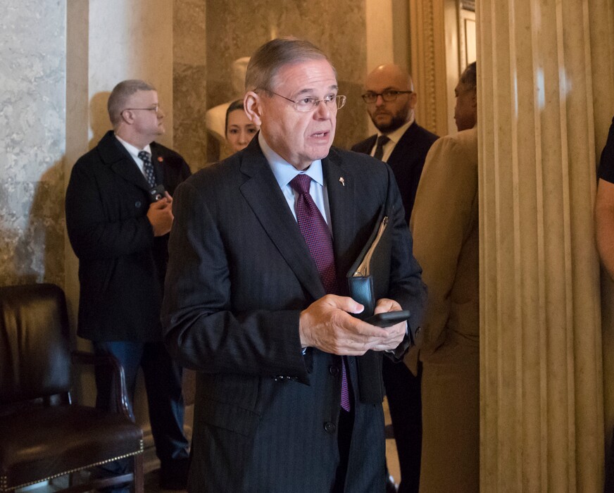 (J. Scott Applewhite | The Associated Press) Sen. Bob Menendez, D-N.J., leaves the chamber after a speech which criticized President Donald Trump's immigration policy and supported "Dreamers," young immigrants helped by the Obama-era Deferred Action for Childhood Arrivals program, at the Capitol in Washington, Wednesday, Feb. 14, 2018.