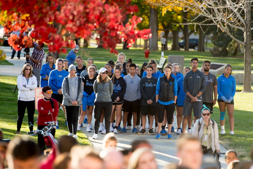 (Jeremy Harmon | The Salt Lake Tribune) Students from UCLA listen during a vigil for Utah track athlete Lauren McCluskey on Wed. Oct 24, 2018. McCluskey was killed on campus on Monday.