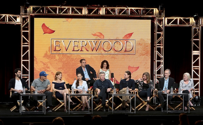 (Chris Frawley | The CW) Back row: Executive producer Greg Berlanti and executive producer Rina Mimoun. Front row: Justin Baldoni, John Beasley, Stephanie Niznik, Vivien Cardone, Treat Williams, Gregory Smith, Emily VanCamp, Tom Amandes and Debra Mooney at the “Everwood” reunion.