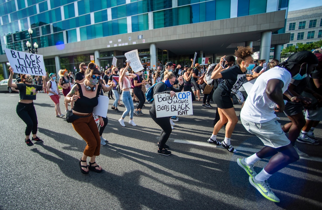 (Rick Egan  |  The Salt Lake Tribune)     Protesters dance in front of the Salt Lake District Attorney's office in Salt Lake City, during a march for racial equality, on Saturday, June 20, 2020.