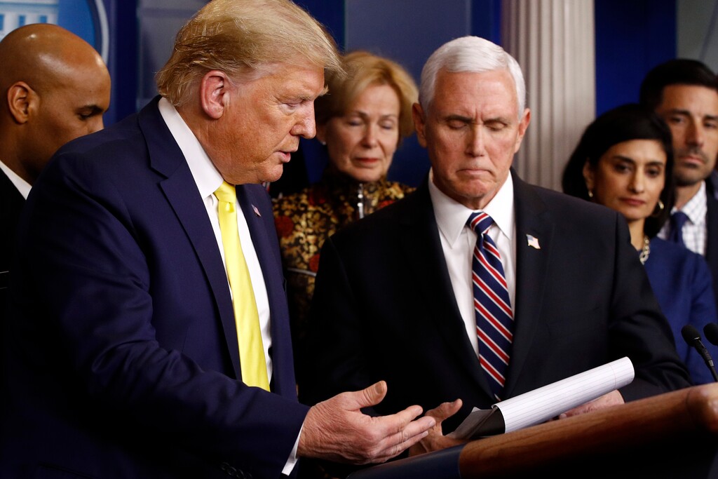 (Patrick Semansky | AP)  President Donald Trump gesture for Vice President Mike Pence to speaks in the briefing room of the White House in Washington, Monday, March 9, 2020, about the coronavirus outbreak.