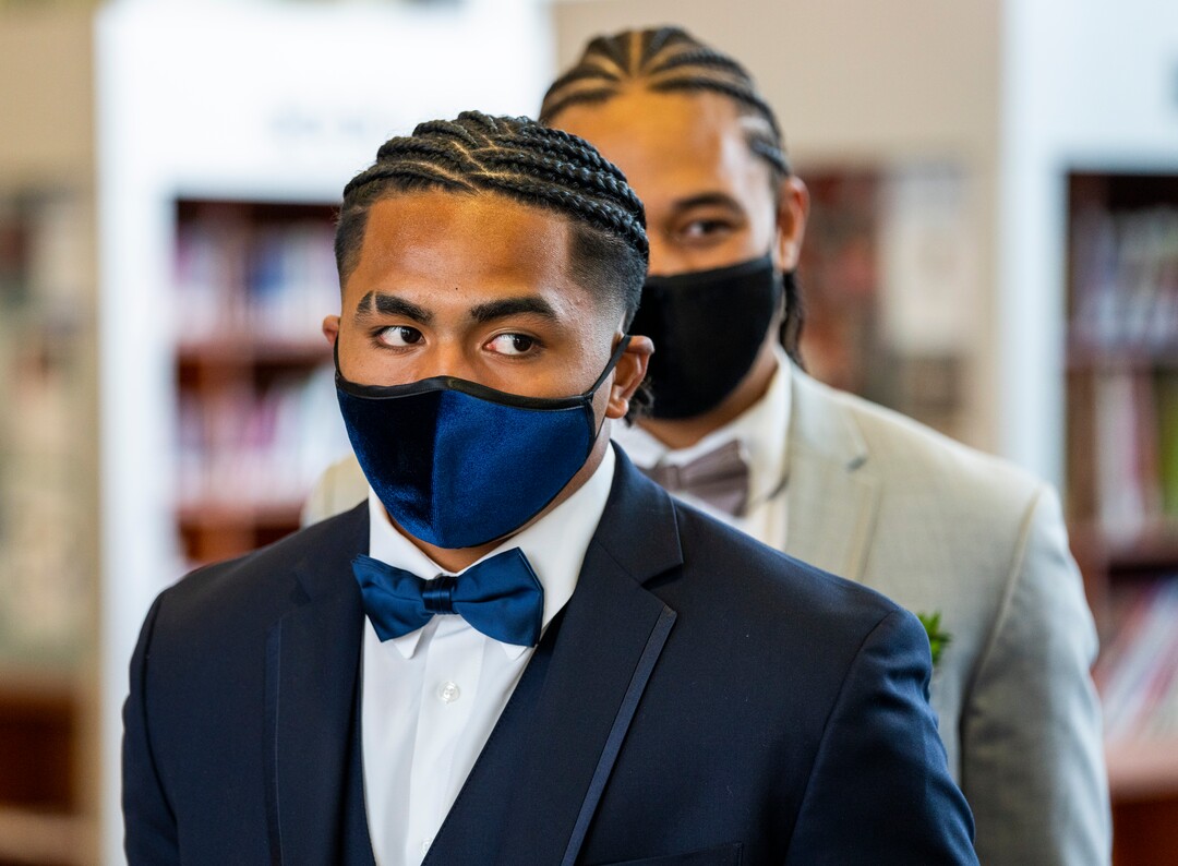 (Rick Egan | The Salt Lake Tribune)Nela Taiese and Trenton Toelupe enter the Cyprus High school Prom, with masks they purchased at 7-11, at the Viridian Event Center, on Saturday, April 24, 2021.