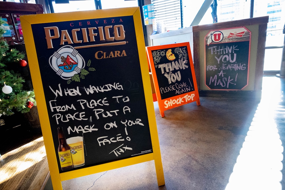 (Francisco Kjolseth  | The Salt Lake Tribune) The Green Pig Pub enforces mask use inside their establishment as a limited clientele comes in for lunch on Thursday, Dec. 3, 2020. The owners of 25 different Utah bars — including the Green Pig Pub —  have sent a letter to Gov. Gary Herbert protesting the state health order that requires alcohol service to stop at 10 p.m They say the restriction is devastating the bar industry in Utah and has caused hundreds of thousands of dollars in lost  revenue, hurt employees, and could force many to close.